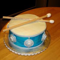 Birthday Drum Cake Cream cheese icing with fondant accents, airbrushed color. Sticks are just real wood with fondant on the ends because i'm not that...