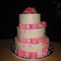 Baptism Cake - Baby Girl Butter cream icing with fondant bows and decorations. Lilies made with Gum Paste. Script wrote in chocolate.