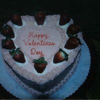 Valentines Day Cake frosted in buttercream with strawberry filling and fresh strawberries