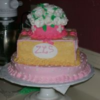 Picture_151.jpg Round cake with square in the middle topped with a round with buttercreme roses on top. thank you for looking at these newbies photos. I...