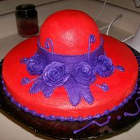 Red Hat Cake Vanilla cake - 12' round for brim - bowl pan for the top of hat . All buttercreme.