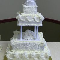 50Th Anniversary Cake Cake was 4 tiers all squares 6", 10", 14" and 18" all white with white roses and leaves. She wanted dots on the top...