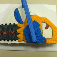 Chainsaw I did this cake for a guy that goes to our church. It was his 71st birthday. He is always out cutting and stacking wood.
