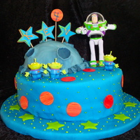 Buzz Lightyear All edible except the figurines. I am blaming the slope of the bottom cake on the moon's lack of gravity. Or something like that. It&#...