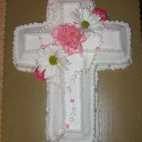 Baptism chocolate cross Iced in BC the flowers are real the rosary was made with royal icing and painted with super pearl dust.