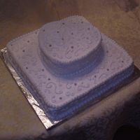 Wedding Shower Cake This is a wedding shower cake with a 10" square base and a 6" heart stacked diagonally on top. It's iced with buttercream...