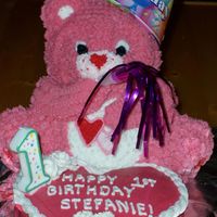 Care Bear Cake I made this for a first birthday party for my niece. I used rasberry juice to color the icing. It was yummy!
