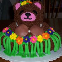 Luau Bear Made this for a friend's daughter. A mixture of fondant, BC, & royal icing flowers. I definitely should have made the halter...