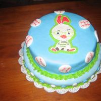 Chicken Little color flow image with fondant cover ... I made this with my friend and partner in crime .. it was our first attempt at a stacked cake .. we...