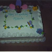 Birthday Cake This is Chocolate cake with bannana custard filling. Decorated with whip cream. Behind is a flower made of royal icing.