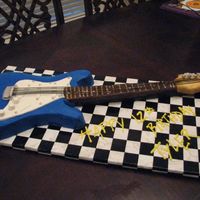 Guitar Made this for a friend who's son wanted a guitar for his birthday. She found one and I made the cake to look exactly like it. The arm...