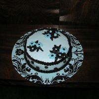 P21707071.jpg Made this cake for a friend's birthday. I loved the plate and tried to use the colors to match.