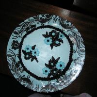 P21707081.jpg First time making a cake for a friend's birthday. I loved the plate and ended up doing a cake to match it.