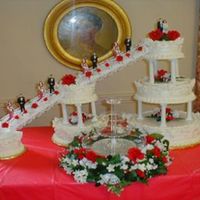 Wilton's "joined In Splendor" Done for a couple's 30th anniversary vow renewal. Coconut cake with coconut cream filling, strawberry cake with strawberry mousse, and...