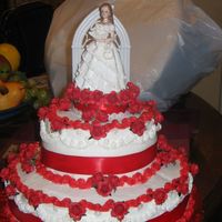 Quince Cake Used buttercream white frosting and silk flowers and a red ribbon.