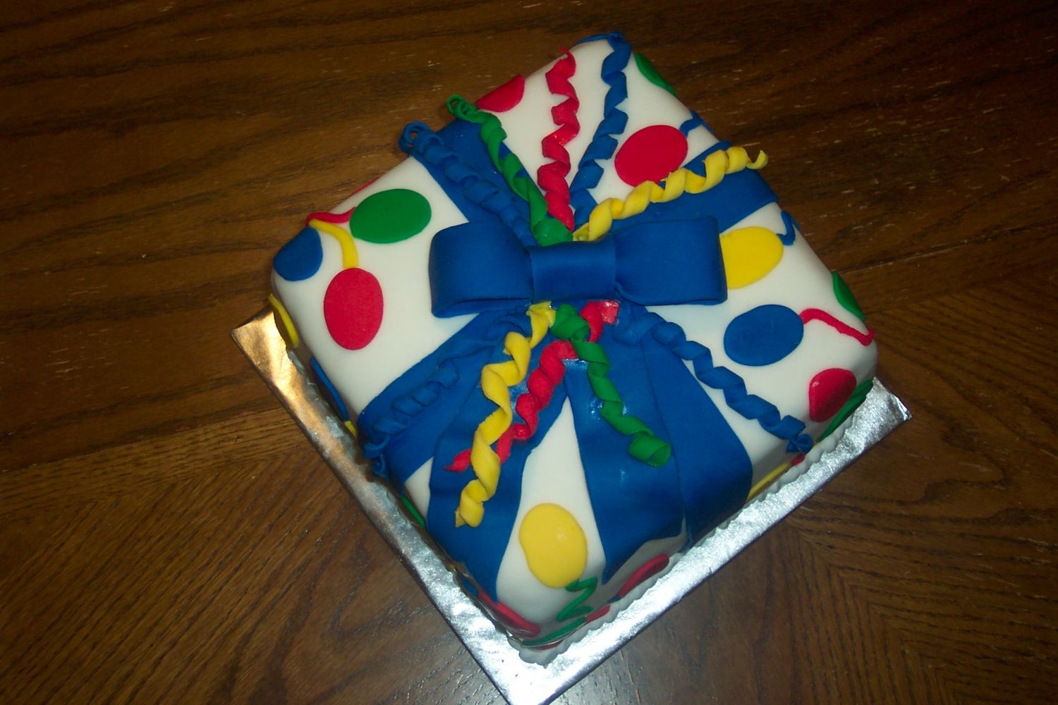 Wilton 3 Class Cake This was the cake I made while learning how to use fondant in Course 3. I sent it in for my sons birthday which worked really well. The...