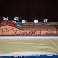 Cub Scout Pinewood Derby This was a cake that I made for my sons cub scout pack for their Pinewood Derby. It was a yellow cake with chocolate buttercream frosting...