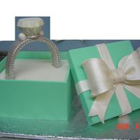 Romantic Valentine's Cake Lemon Curd Yellow cake, gum paste ring with white chocolate diamond.