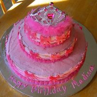 3 Tier Princess Cake 3 tier cake with fondant cookie cutter ribbon cut outs.