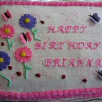 First Sheet Cake For Girl's Birthday Frosted with bc dream, color flow butterflies and ladybugs. Royal icing flowers.