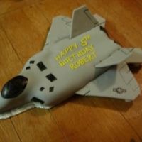 F22 Raptor Jet This is supposed to be a F-22 Raptor. It's buttercream covered with fondant. In the picture, I still have couplers supporting the...