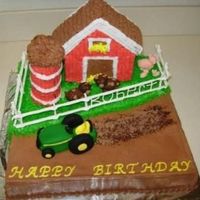 John Deere This is frosted in buttercream with a royal icing fence. The tractor and animals are fondant. I made the silo out of cookies on a dowel rod...