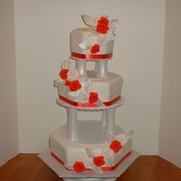 Red Rose Hexagon Wedding Cake Three tier hexagon shaped wedding cake. Covered with fondant and fondant roses.