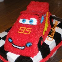 Lightening Mcqueen Started w/ the Wilton Cruiser car pan and made alterations to make it look more like a race car. It's all done with buttercream icing...