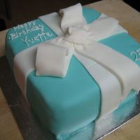 Tiffany's Inspired Cake Turquoise coloured fondant, cut out fondant pieces for bow. Double layer chocolate cake.