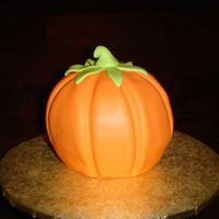 Mini Pumpkin This mini pumpkin was done using Wilton's mini ball pan. I stuck to halves together and covered with fondant, using the handle of a...