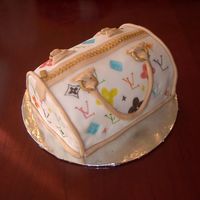 Louis Vuitton Cake This is my version of the Louis Vuitton cake. I thought it turned out okay but I wish I knew how to paint fondant better. This is done with...