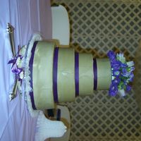 Potts Wedding Cake Butter cream icing and purple ribbon with real flowers