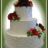 Tt's Wedding Cakes 22 Silk Flowers, 6", 8" and 12" round cakes. Free-hand scroll-work.