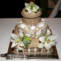 Round Wedding Cake this is a mocha and white wedding cake with real flowers o top