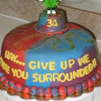 Cake_1.jpg Burbon Chocolate Cake covered with MMF... I took the picture before putting all the candles that were supposed to sorround the guy!