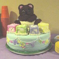 Baby Bear With Blocks On A Blanket Photo 1 of 2. This is my first tiered and shower cake :). It is a 14" WASC covered in MMF. The bear is BC and the blocks are fondant...
