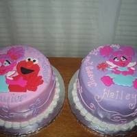 Elmo & Abby Royal icing plaques on buttercream.