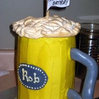 Beer Stein 4 6" Almond Sour Cream Cakes, stacked. Iced in buttercream with fondant accents. Meringue "foam" on top. This was one heavy...