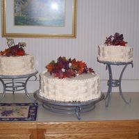 Grandma & Pappap's 60Th Anniversary The cake on the left has a picture of my grandparents the day they got married. They loved this cake. It was done with ivory buttercream...