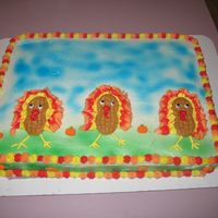 Turkey Cake Chocolate cake with buttercream frosting. Candy pumpkins. Nutter butter cookies for the turkeys bodies.