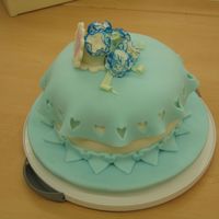 Carnations This is a white enhanced cake with butter cream frosting. On top of that is a layer of white fondant and then the blue fondant. The...