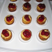 Mini Cherry Cheesecakes These are mini cheesecakes topped with cherries.