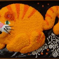 Orange Cat Cake Its an orange cat cake made from the Wilton Lady Bug pan. I made the tail, the paws & the ears out of rice kripies.