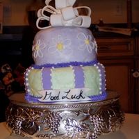 P1010044_044.jpg crusting buttercream icing with fondant accents and gumpaste bow.. was a first for all but turned out allright!