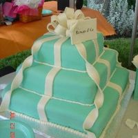 Tiffany & Co. Wedding Cake Cake is covered in fondant and all accents are made from fondant. I matched a Tiffany's bag (used in background to hold napkins.)