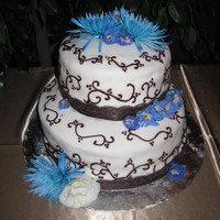 Wedding Cake This couple wanted 2 cakes; one chocolate fondant, one white fondant. When I arrived at the hall to set up, the florist did not deliver the...