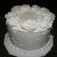 Wilton Class One - Final Cake Butter cake with buttercream icing. Roses are done with buttercream icing, filling is lemon. Had a little trouble with making roses, but...