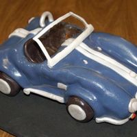 English Car first place 'fair theme' winner old English car. Fondant over pound cake. I used confectioners glaze for the shiny bits and...