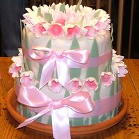 Hand Painted Crocus Flower fondant with hand modled and painted crocus flowers and leaves. real ribbon