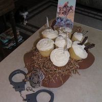 Cowboy Cupcake Bouquet I wanted to do a special cupcake bouquet for Father's Day. This is a cowboy hat turned upside down (from dollar store). Then made...